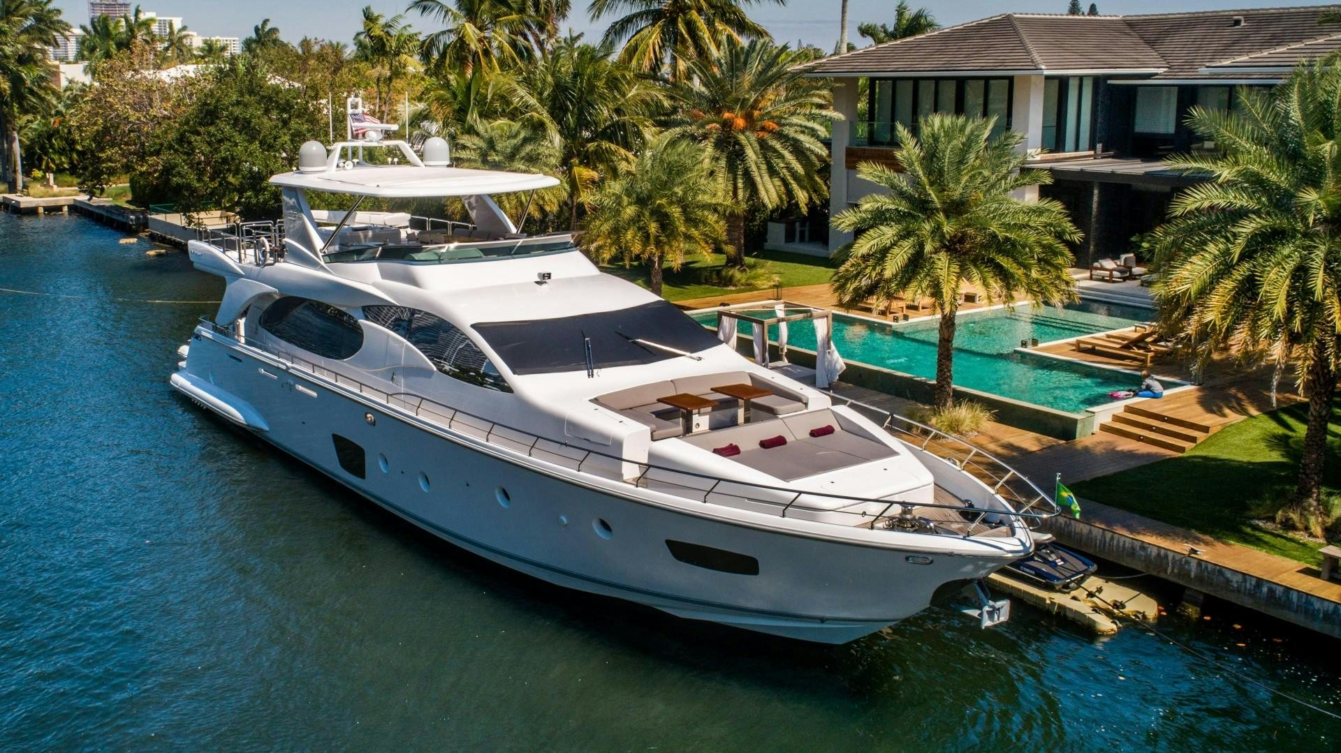a boat docked at a pier aboard Blue Yacht for Sale