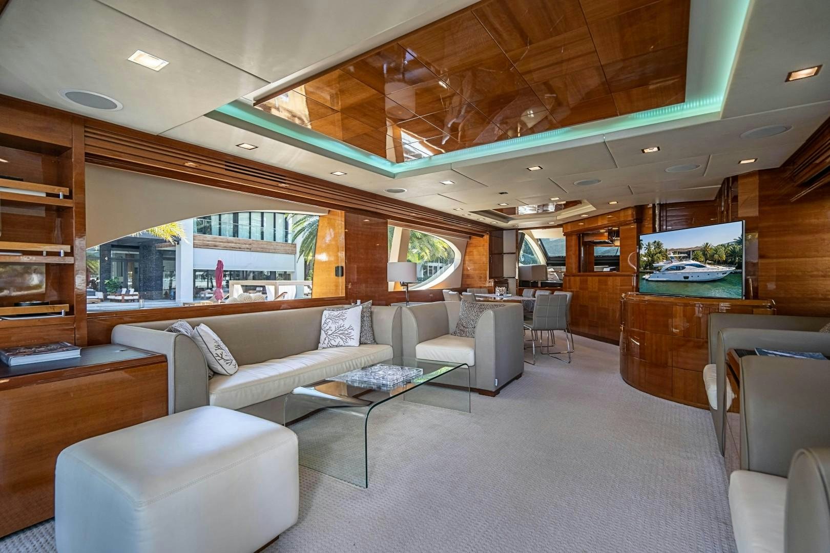 a living room with a large fish tank aboard Blue Yacht for Sale