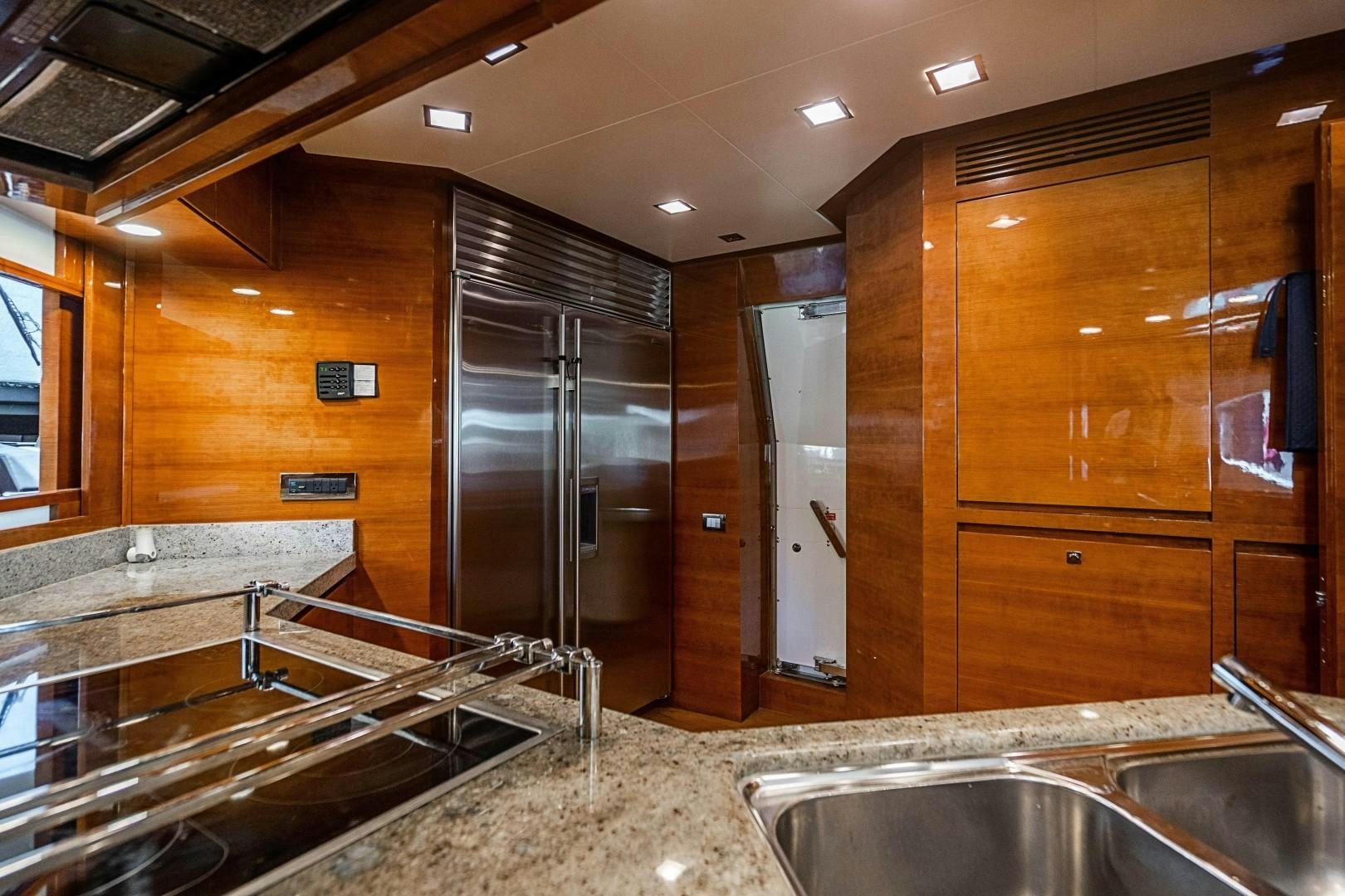 a large kitchen with stainless steel appliances aboard Blue Yacht for Sale