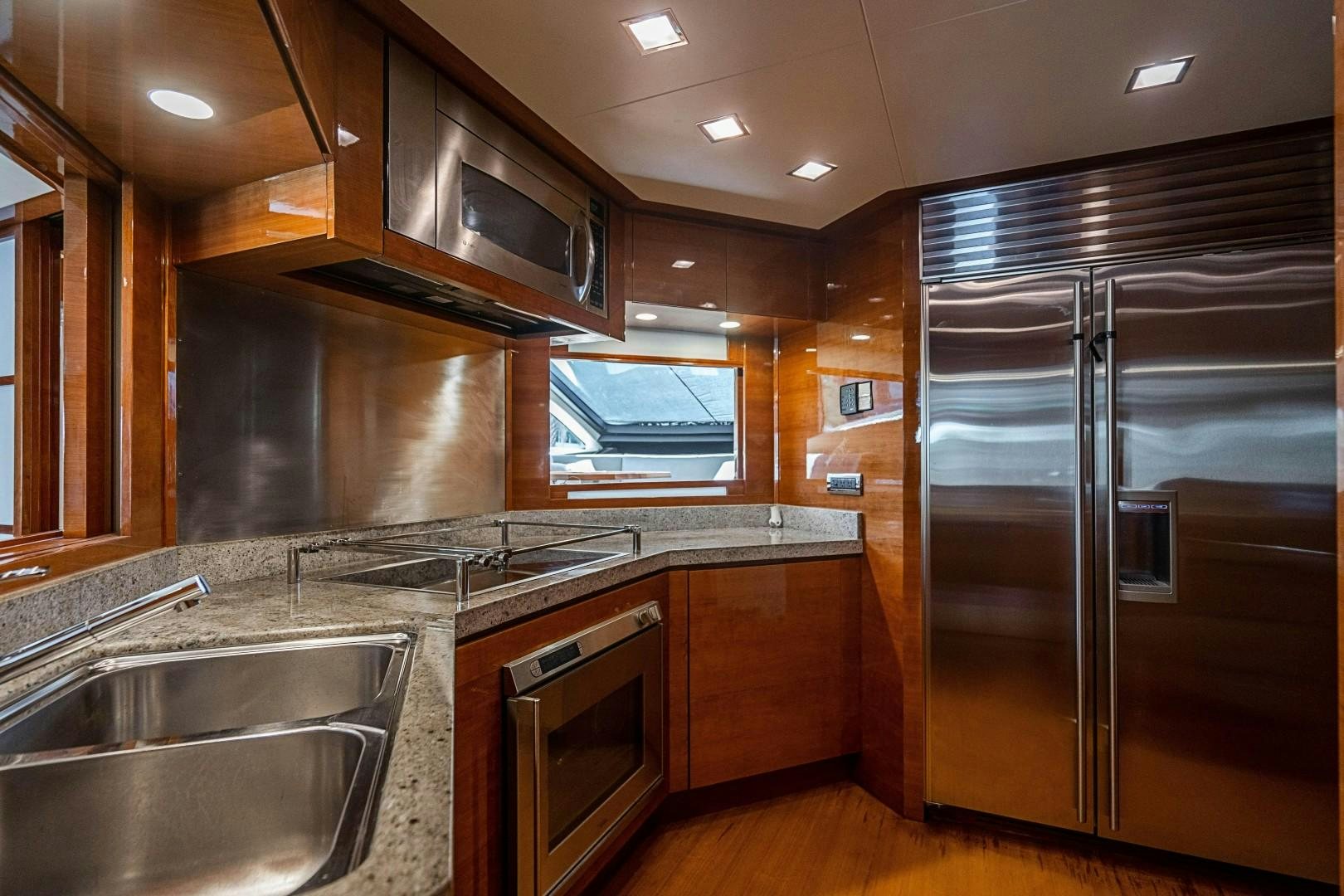 a kitchen with stainless steel appliances aboard Blue Yacht for Sale