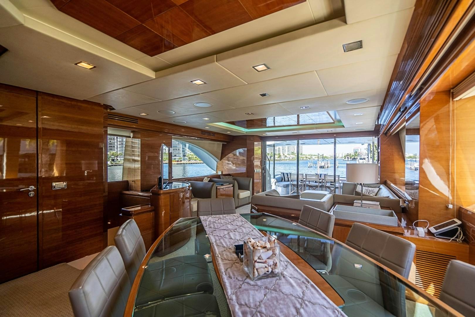 a room with a table and chairs aboard Blue Yacht for Sale