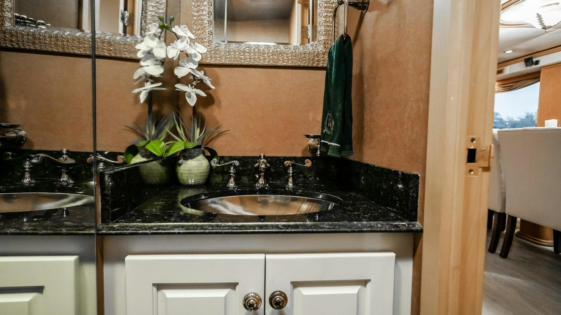 a kitchen with a sink and a plant on the counter aboard COME MONDAY Yacht for Sale