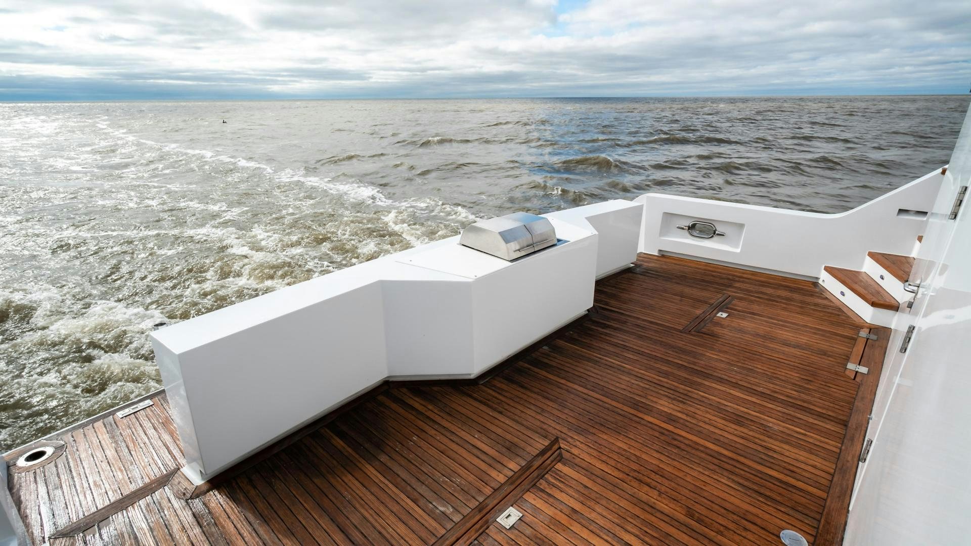 a deck with a view of the ocean and the ocean aboard COME MONDAY Yacht for Sale