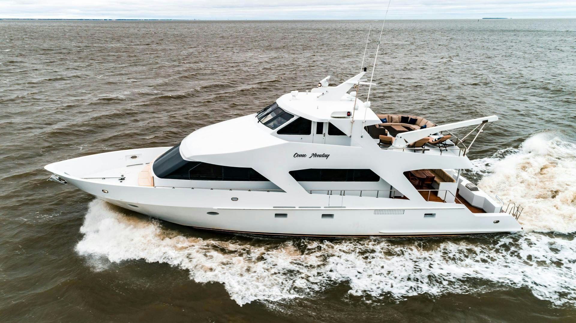a white yacht in the water aboard COME MONDAY Yacht for Sale
