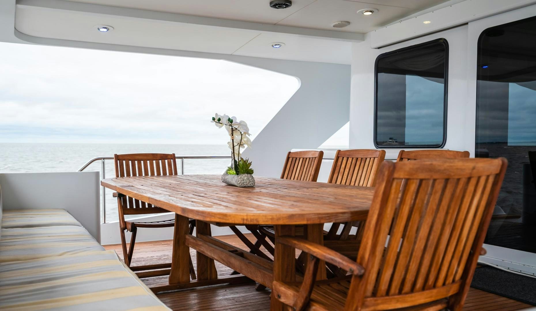 a table with chairs around it aboard COME MONDAY Yacht for Sale