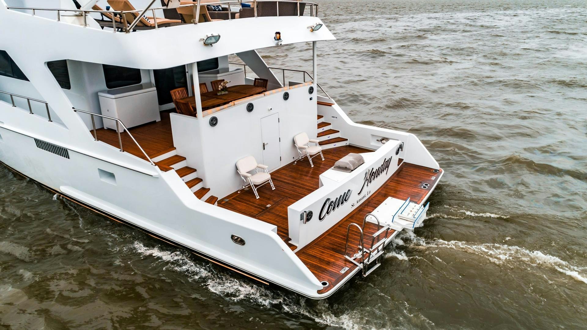 a white boat in the water aboard COME MONDAY Yacht for Sale