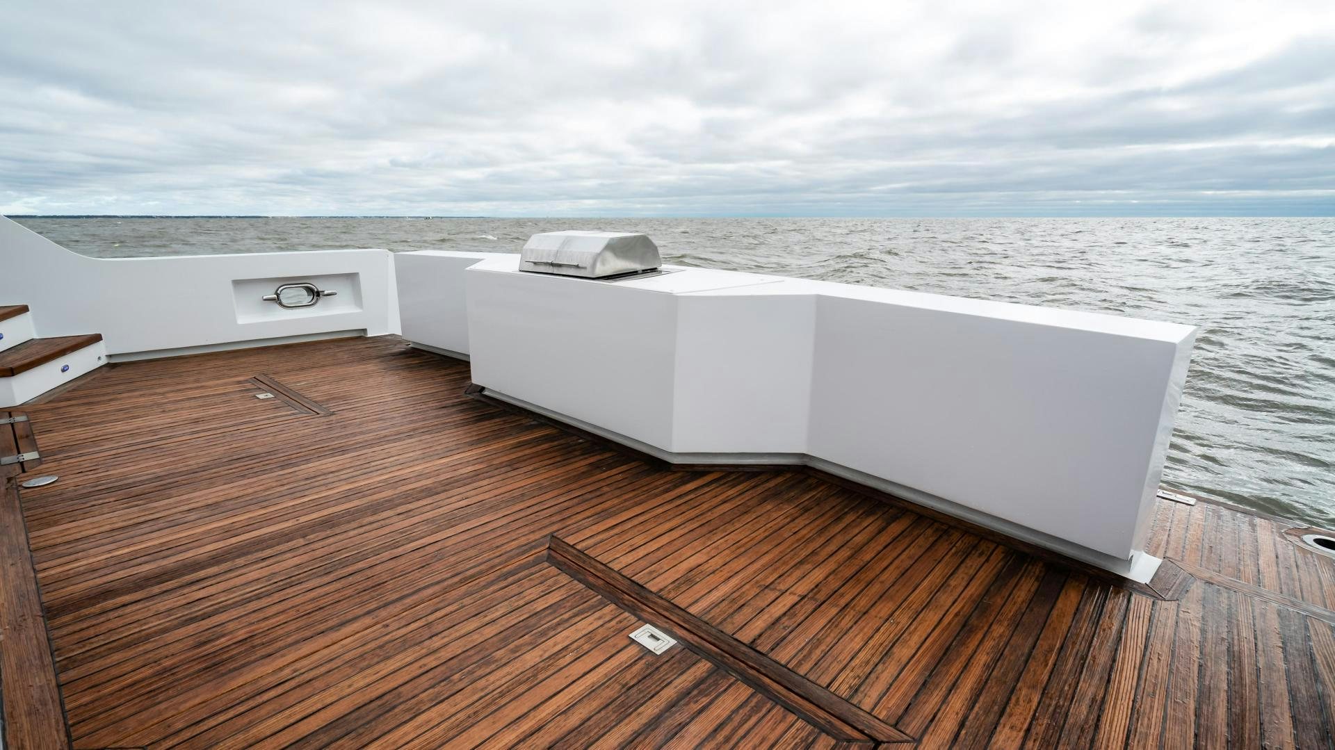 a white rectangular object on a wooden surface aboard COME MONDAY Yacht for Sale