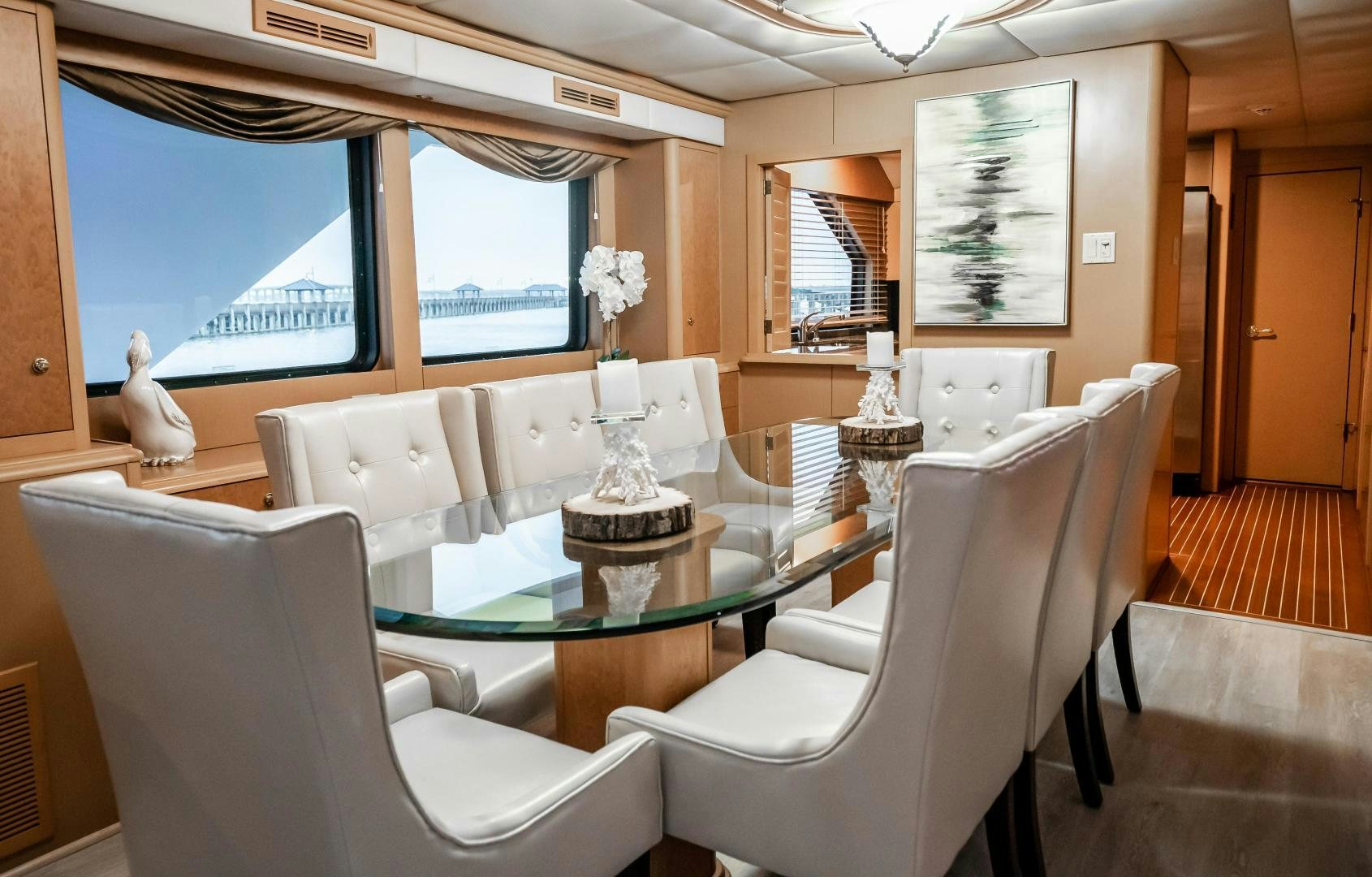 a room with a table chairs and a window aboard COME MONDAY Yacht for Sale