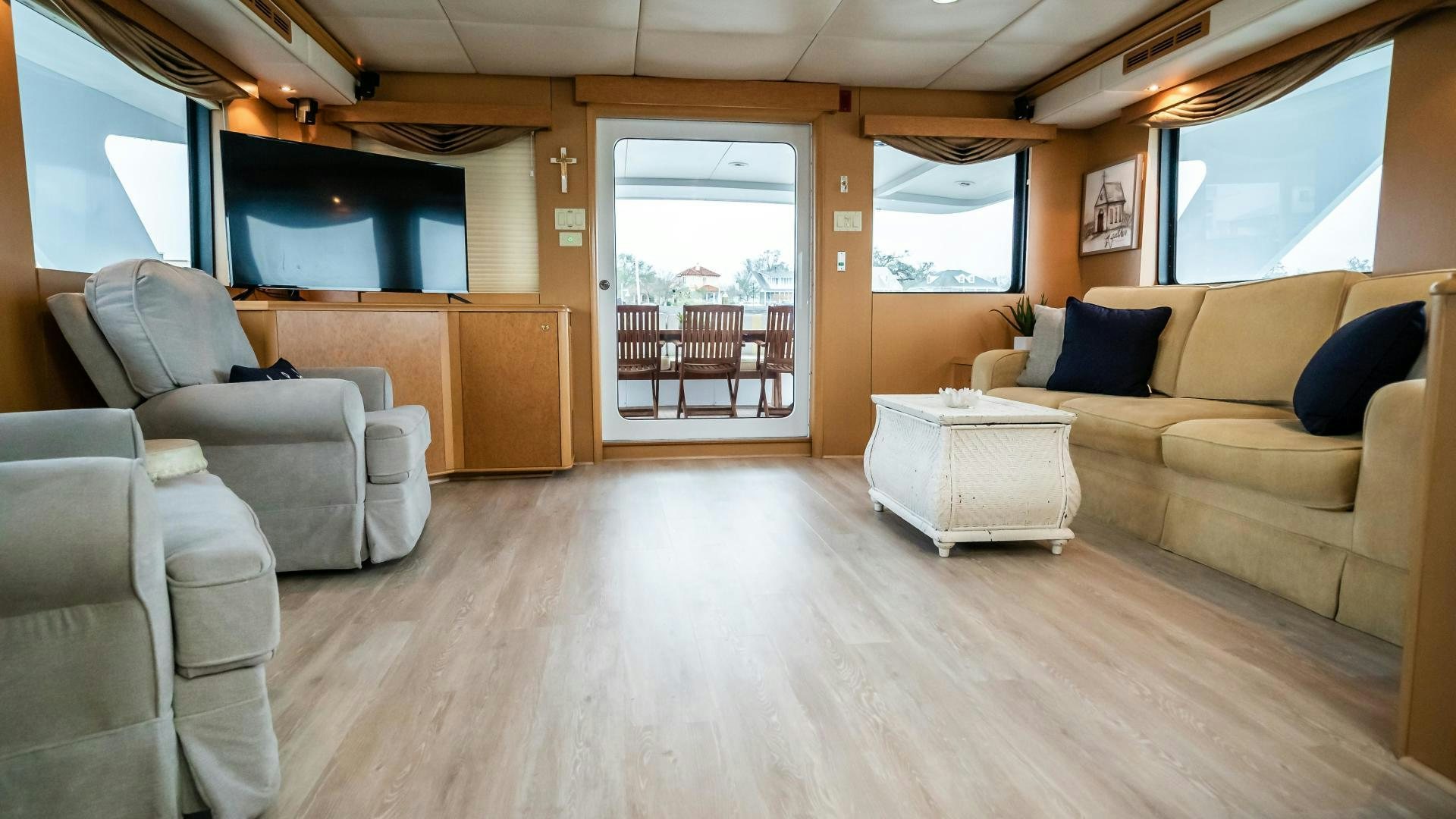 a living room with a couch and a table aboard COME MONDAY Yacht for Sale
