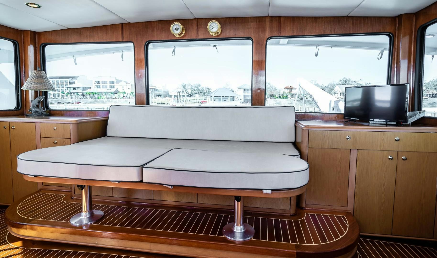 a white couch in a room aboard COME MONDAY Yacht for Sale