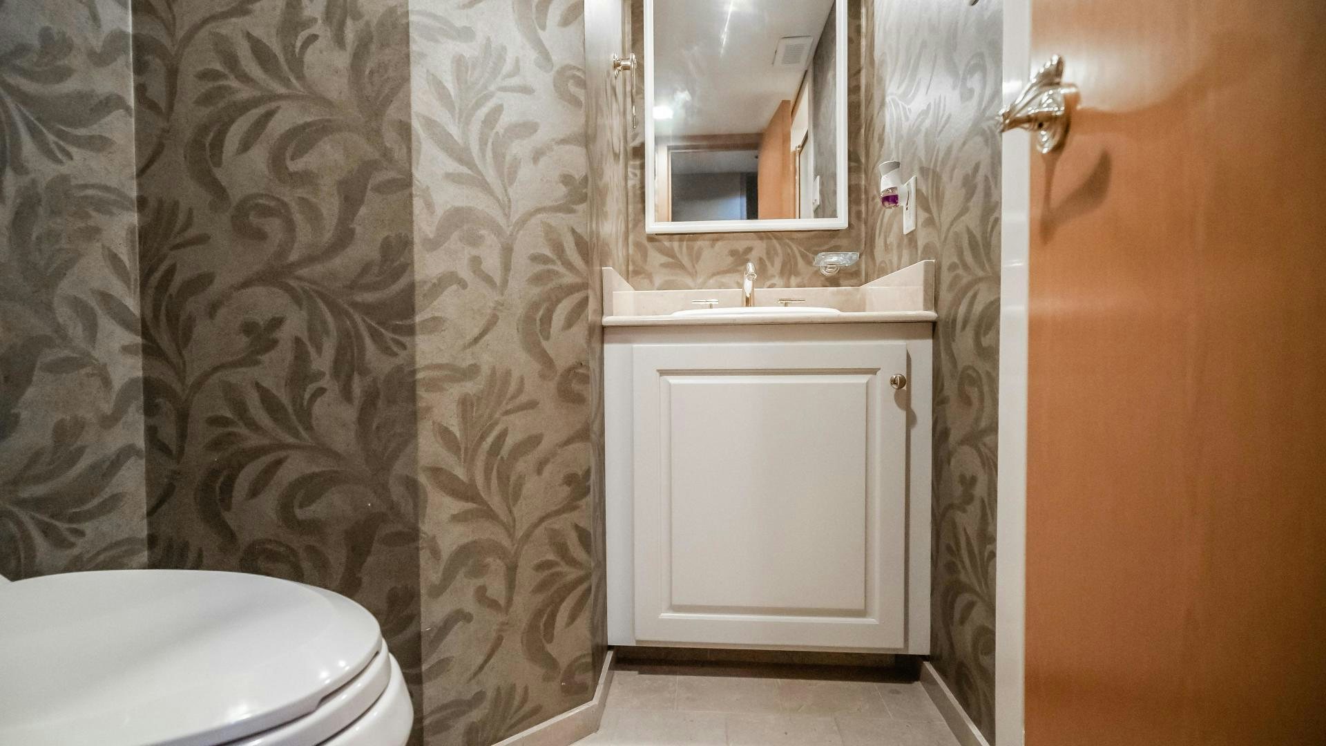 a bathroom with a toilet and sink aboard COME MONDAY Yacht for Sale
