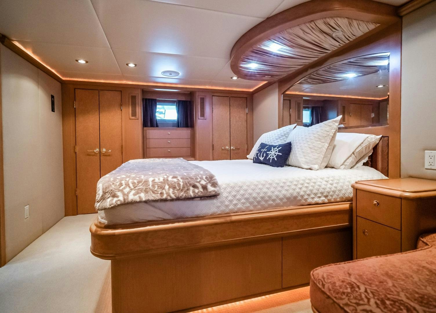 a bedroom with a bed and a ceiling fan aboard COME MONDAY Yacht for Sale