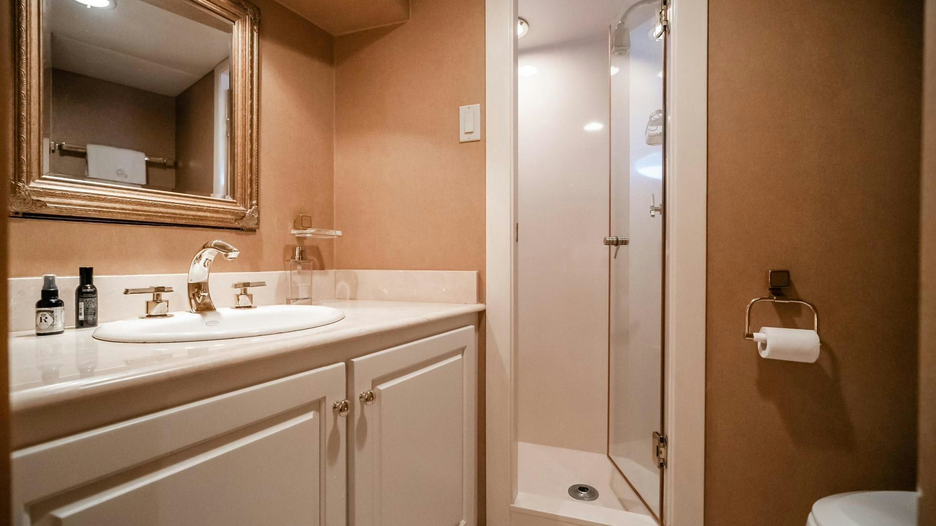 a bathroom with a sink and a shower aboard COME MONDAY Yacht for Sale