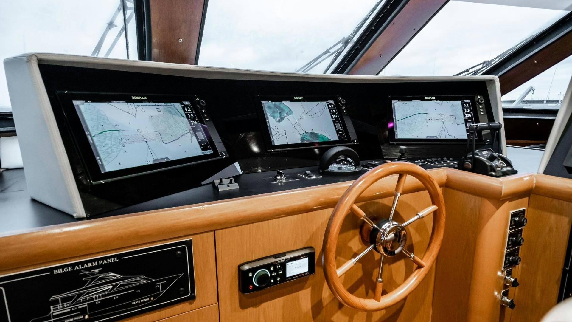a wooden boat with a steering wheel aboard COME MONDAY Yacht for Sale