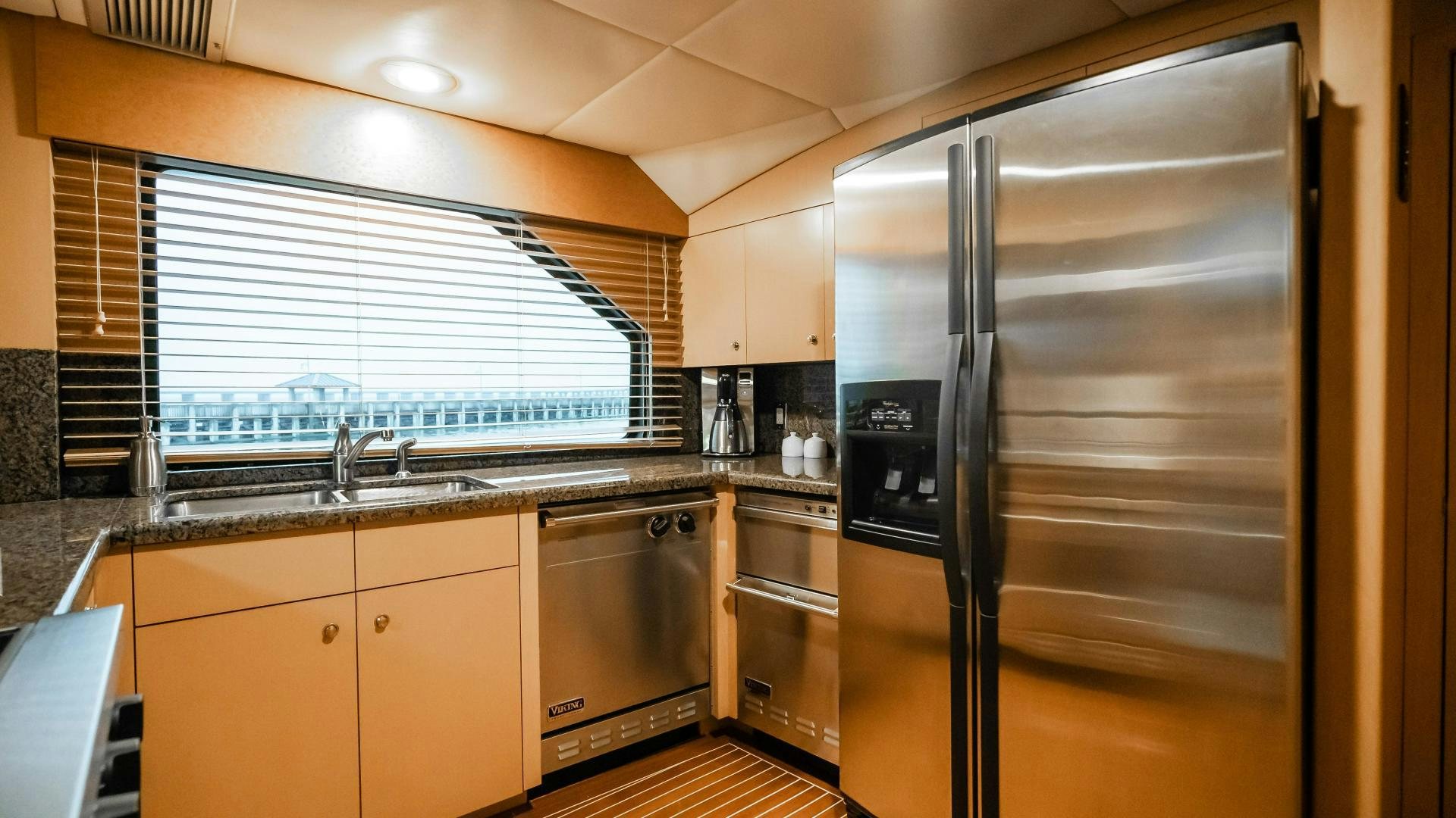 a kitchen with stainless steel appliances aboard COME MONDAY Yacht for Sale