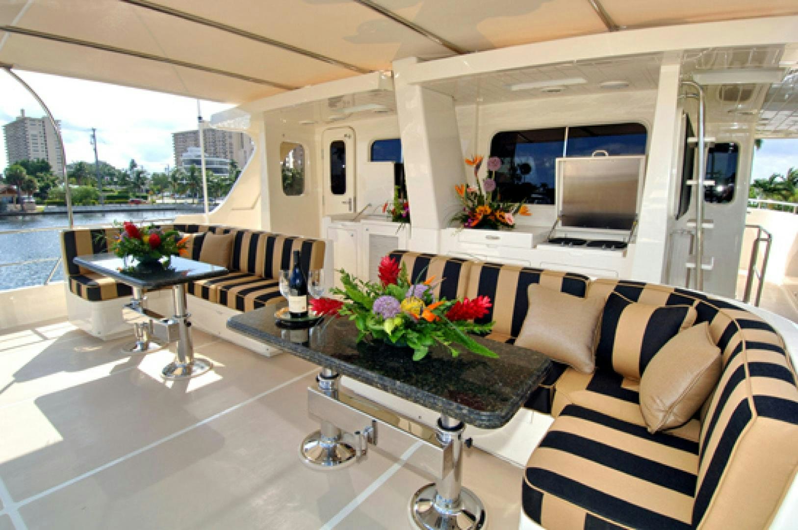 a living room with a table and chairs aboard No Name Yacht for Sale