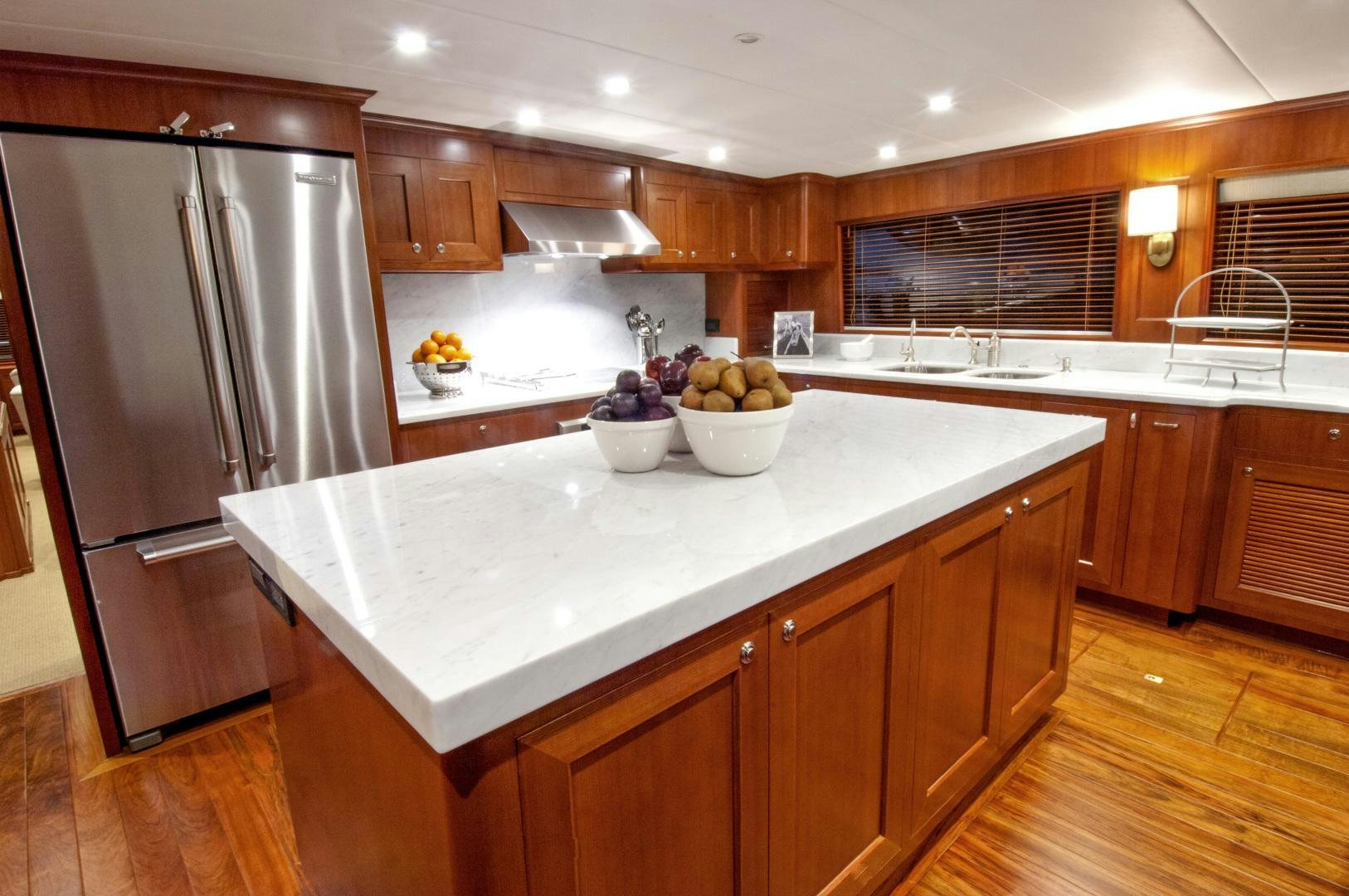 a kitchen with a stainless steel refrigerator aboard No Name Yacht for Sale