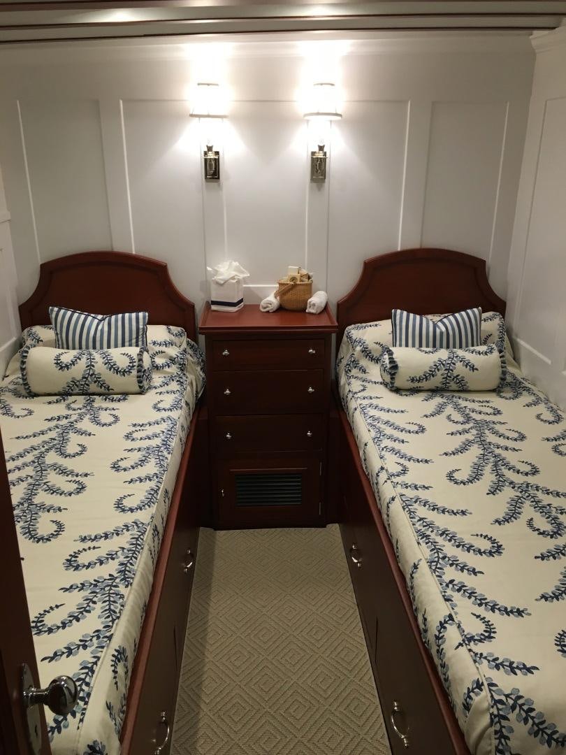 a couple of beds in a room aboard ENTICER Yacht for Sale