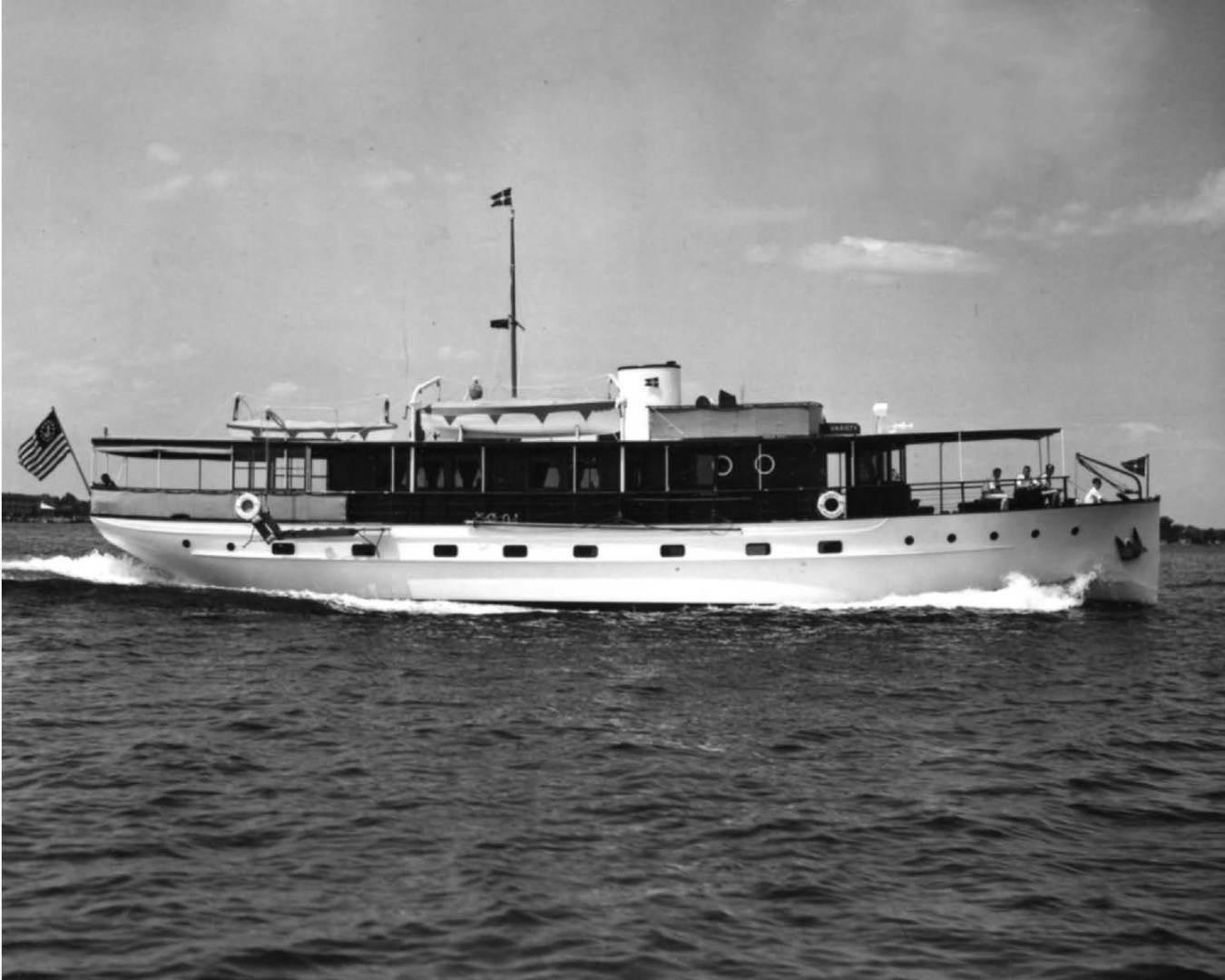 a large boat on the water aboard ENTICER Yacht for Sale