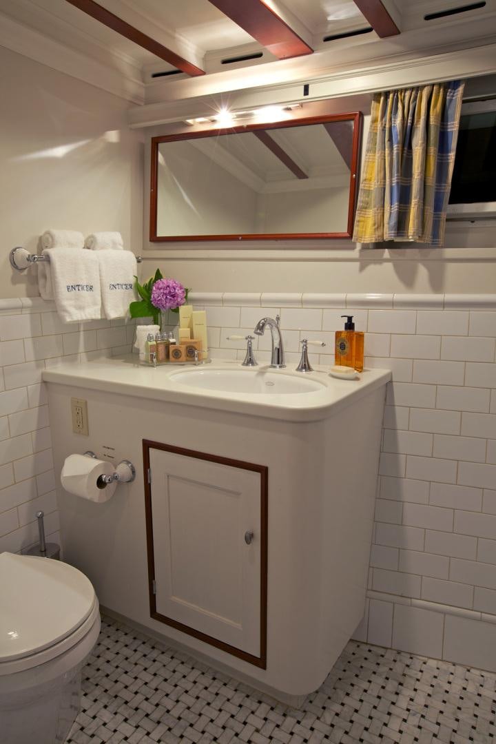 a bathroom with a sink and toilet aboard ENTICER Yacht for Sale