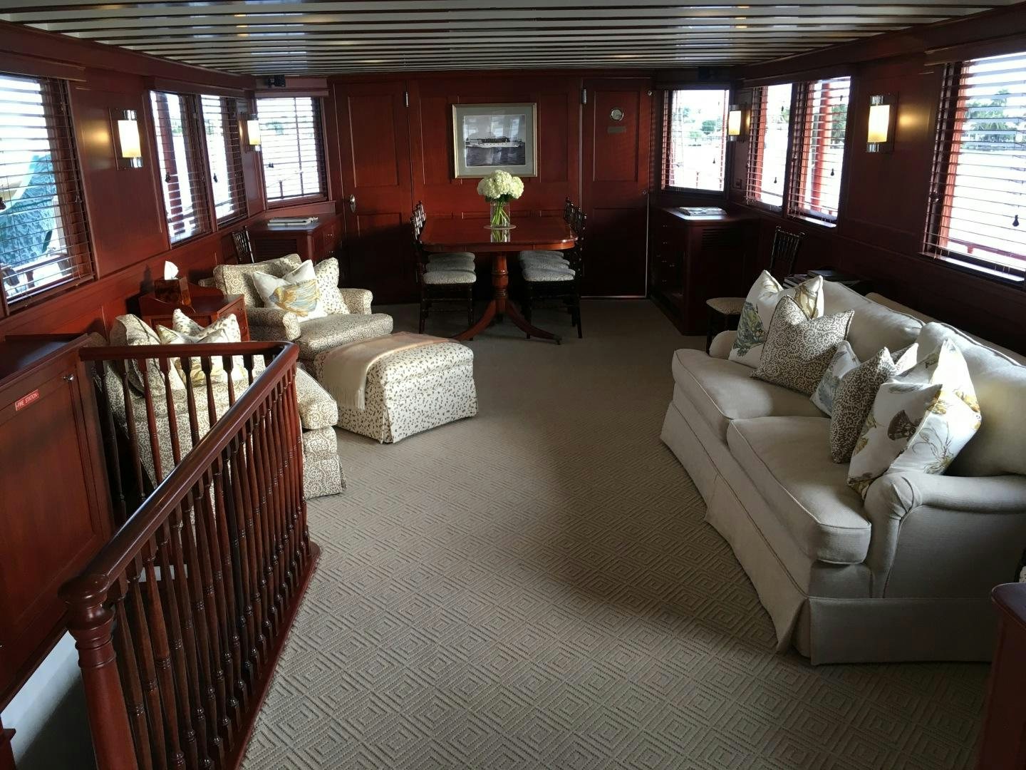 a living room with a couch and a table aboard ENTICER Yacht for Sale