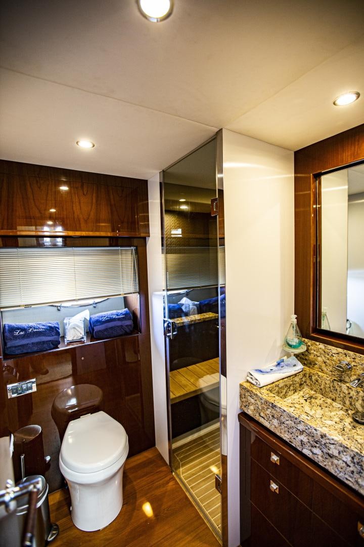 a bathroom with a glass shower aboard LAS BRISAS Yacht for Sale