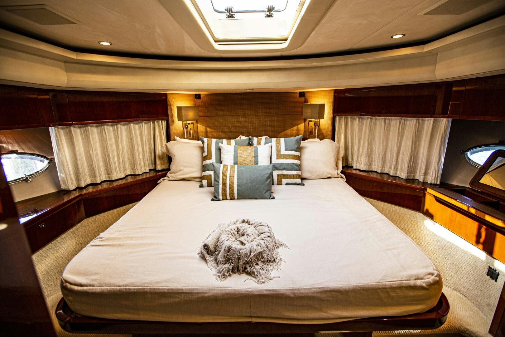 a large bed with white sheets aboard LAS BRISAS Yacht for Sale