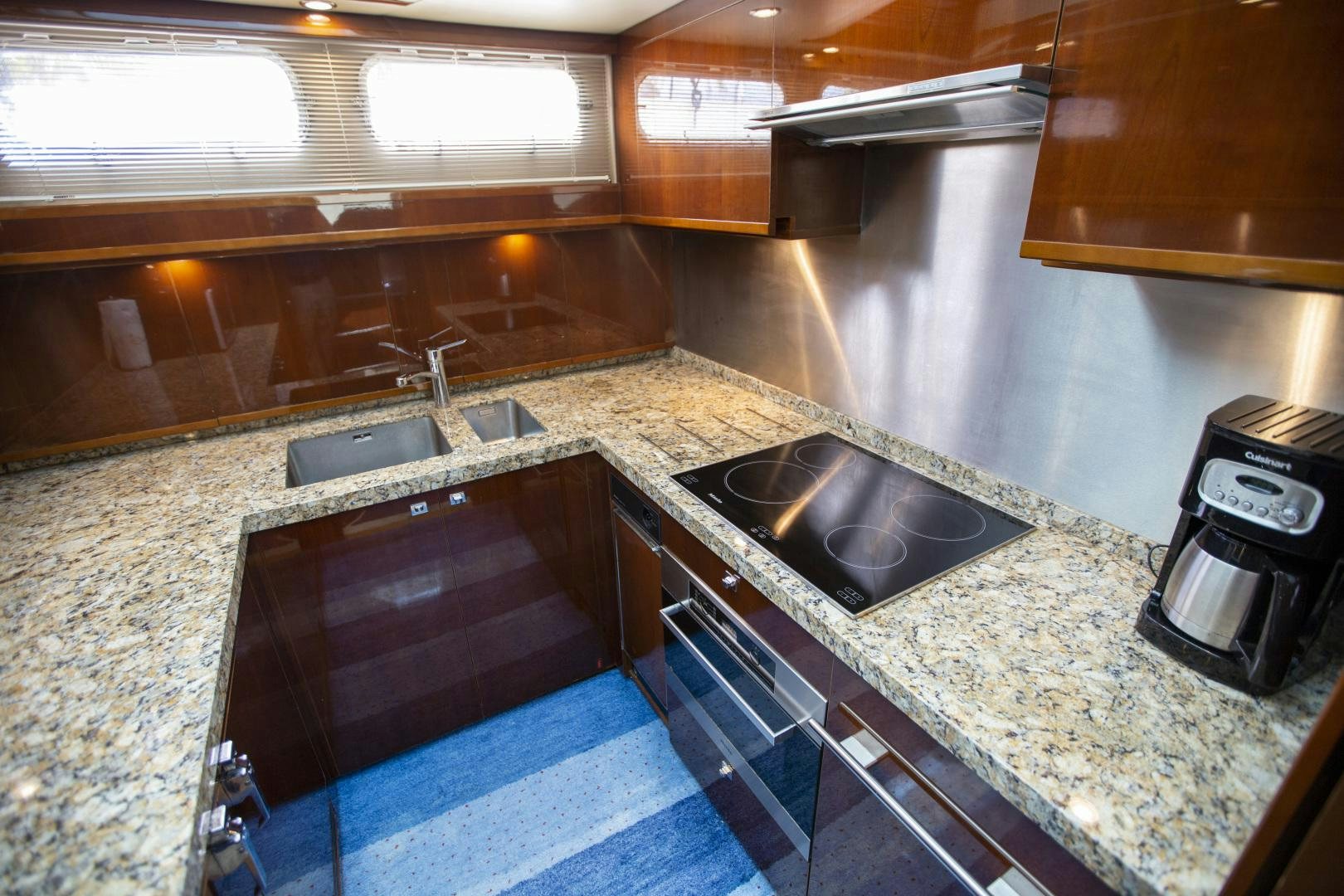 a kitchen with a sink and a microwave aboard LAS BRISAS Yacht for Sale