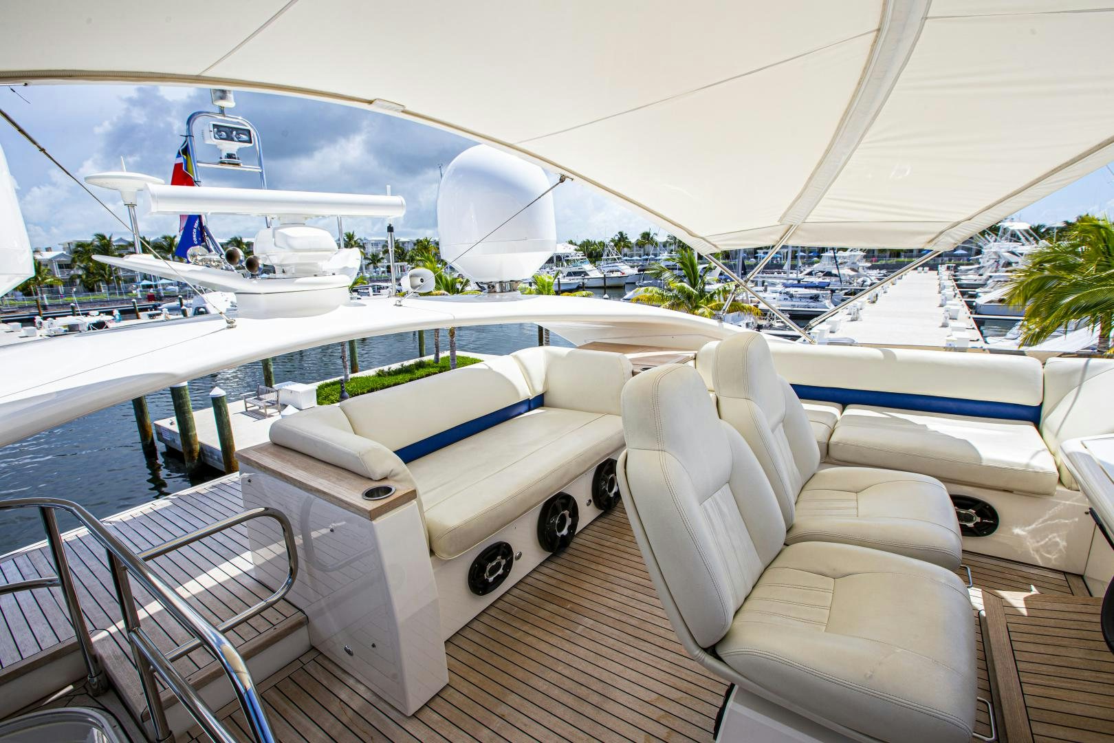 a white car on a deck aboard LAS BRISAS Yacht for Sale