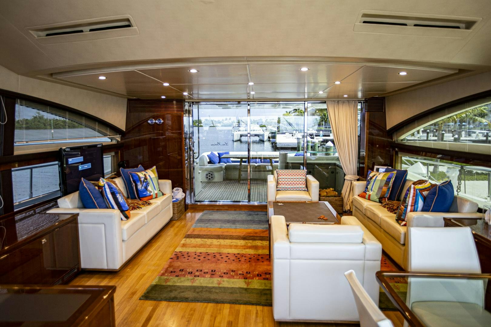 a living room with a view of the water aboard LAS BRISAS Yacht for Sale