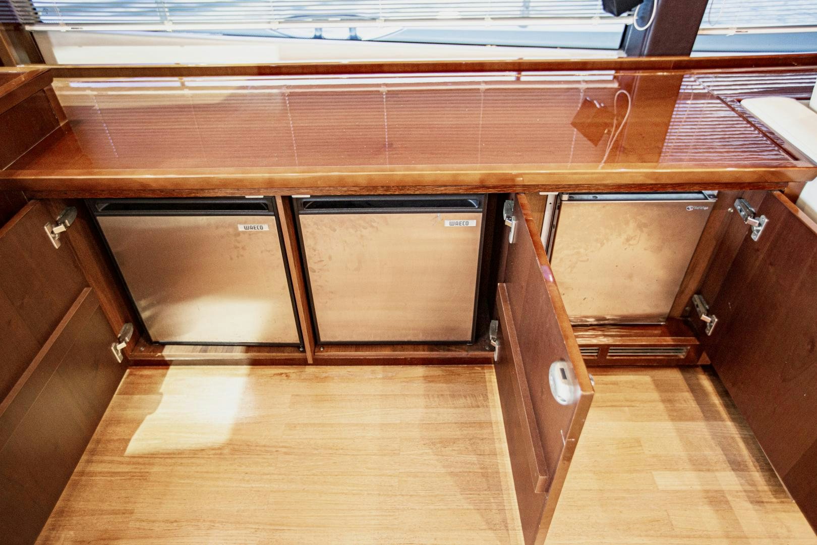 a wooden cabinet with drawers aboard LAS BRISAS Yacht for Sale