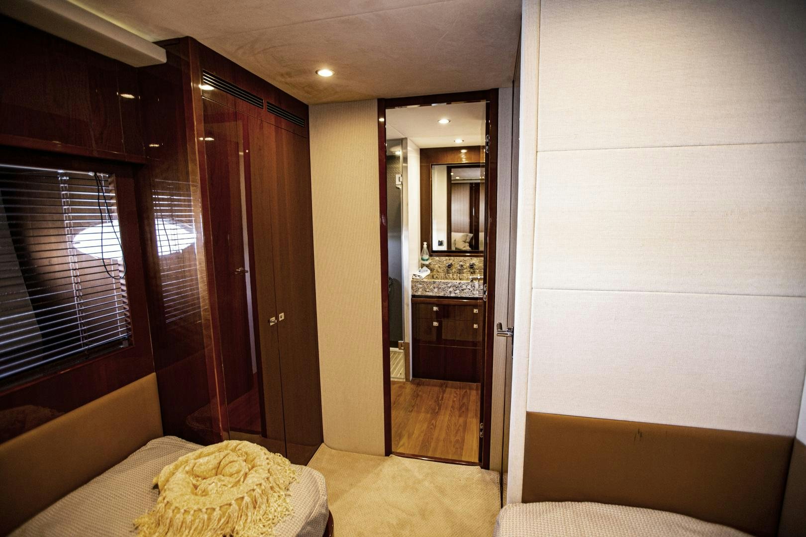 a room with a bed and a closet aboard LAS BRISAS Yacht for Sale