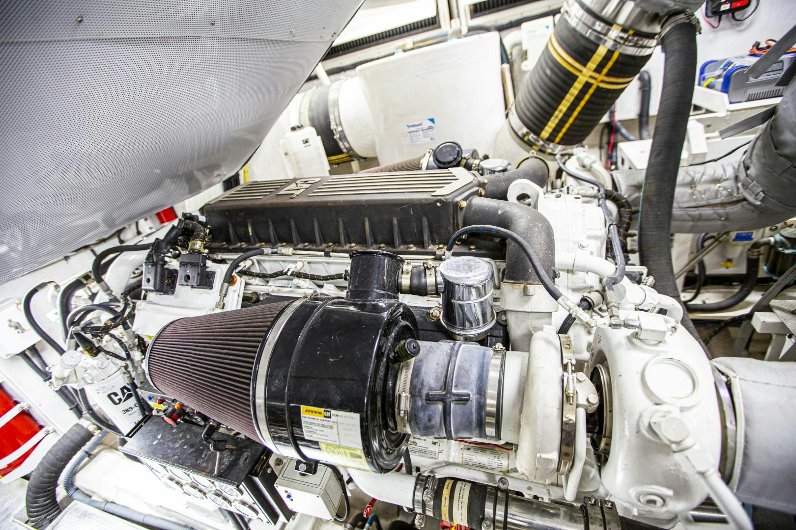 a car engine with a yellow cap aboard LAS BRISAS Yacht for Sale