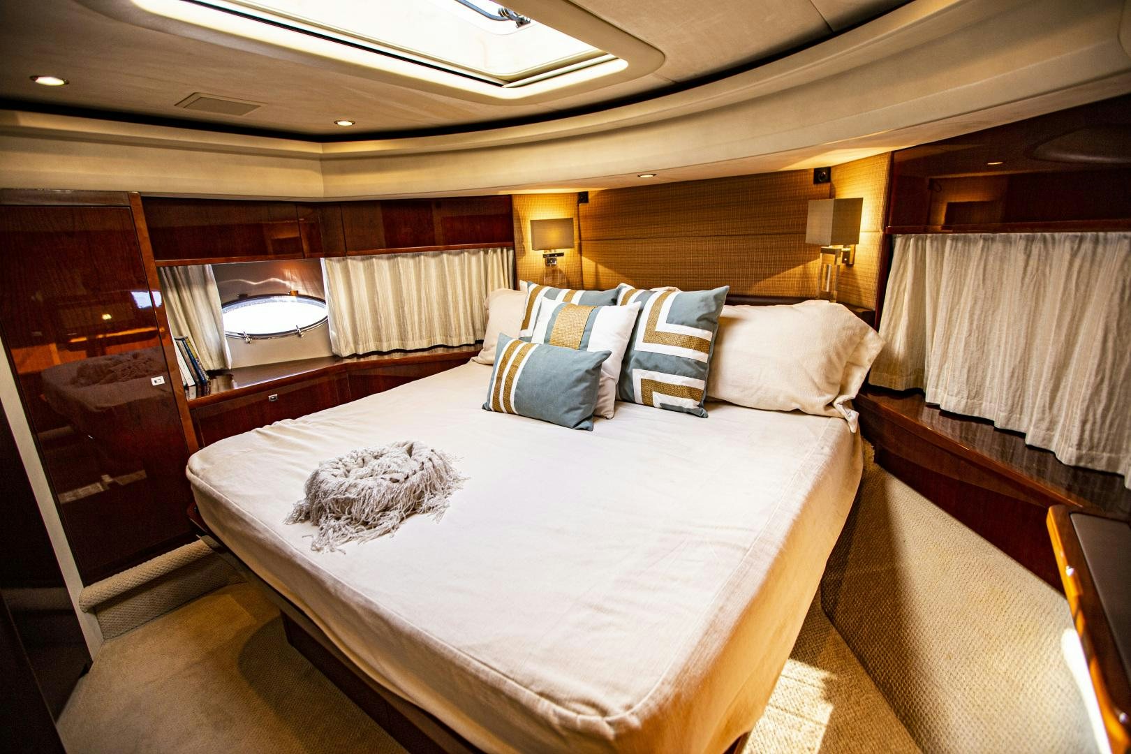 a room with a bed and a window aboard LAS BRISAS Yacht for Sale