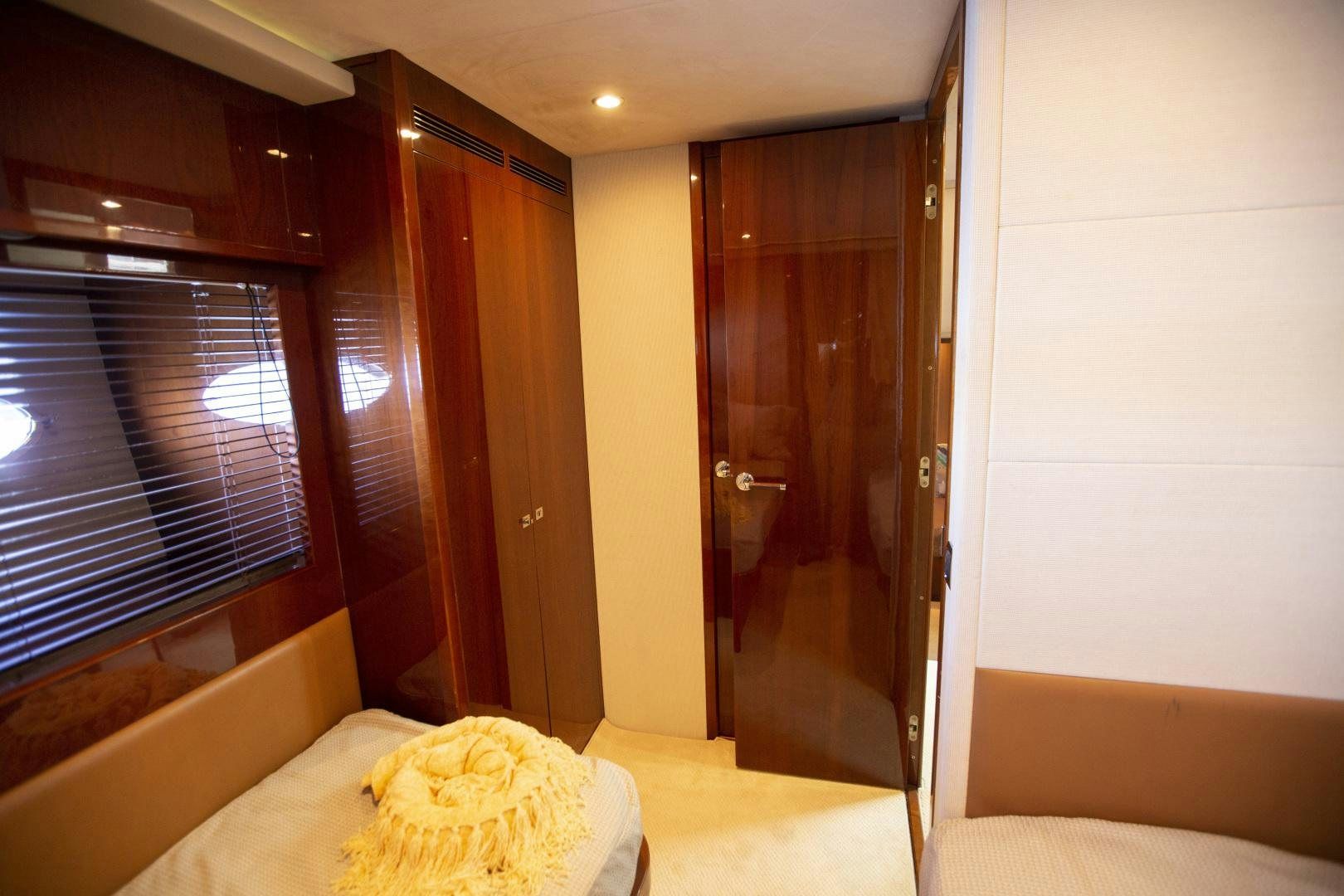 a room with a bed and a door aboard LAS BRISAS Yacht for Sale