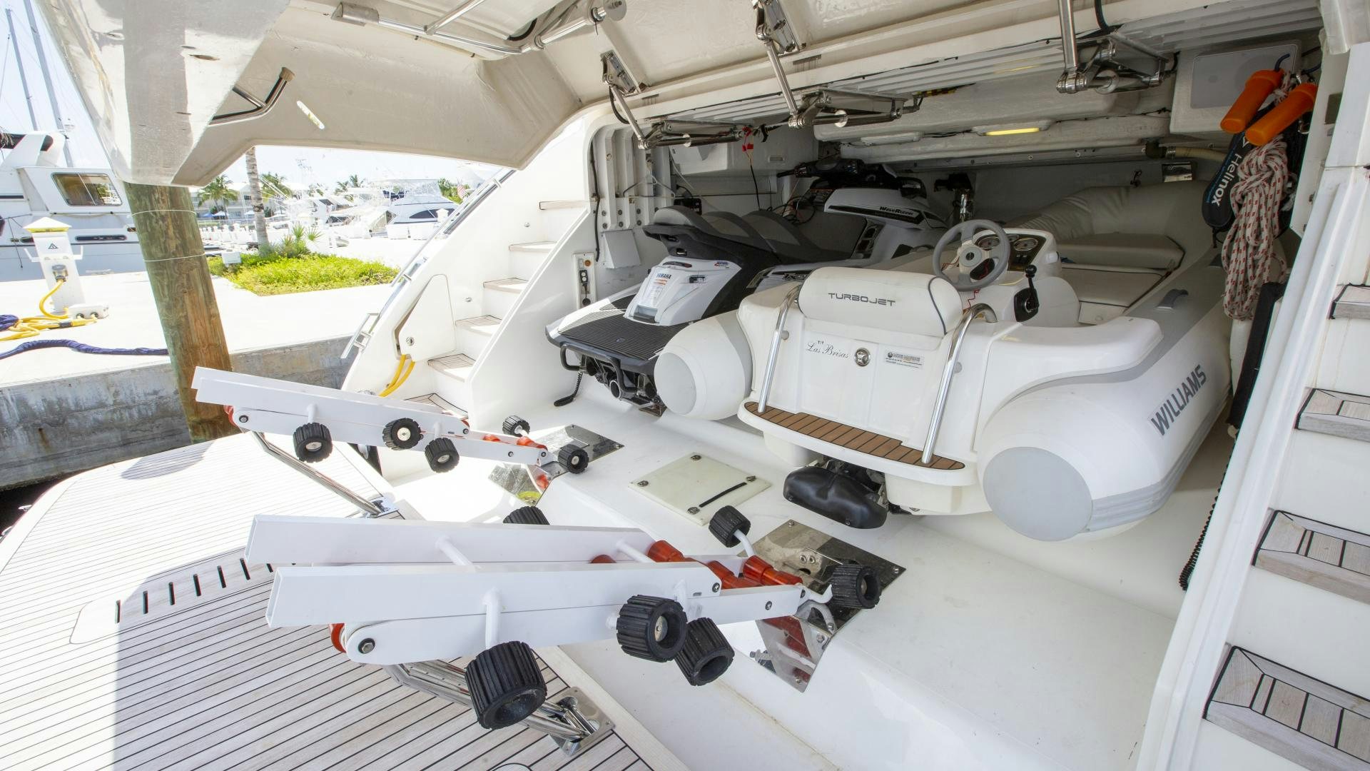a white space ship with a black and white tank and a white surface aboard LAS BRISAS Yacht for Sale