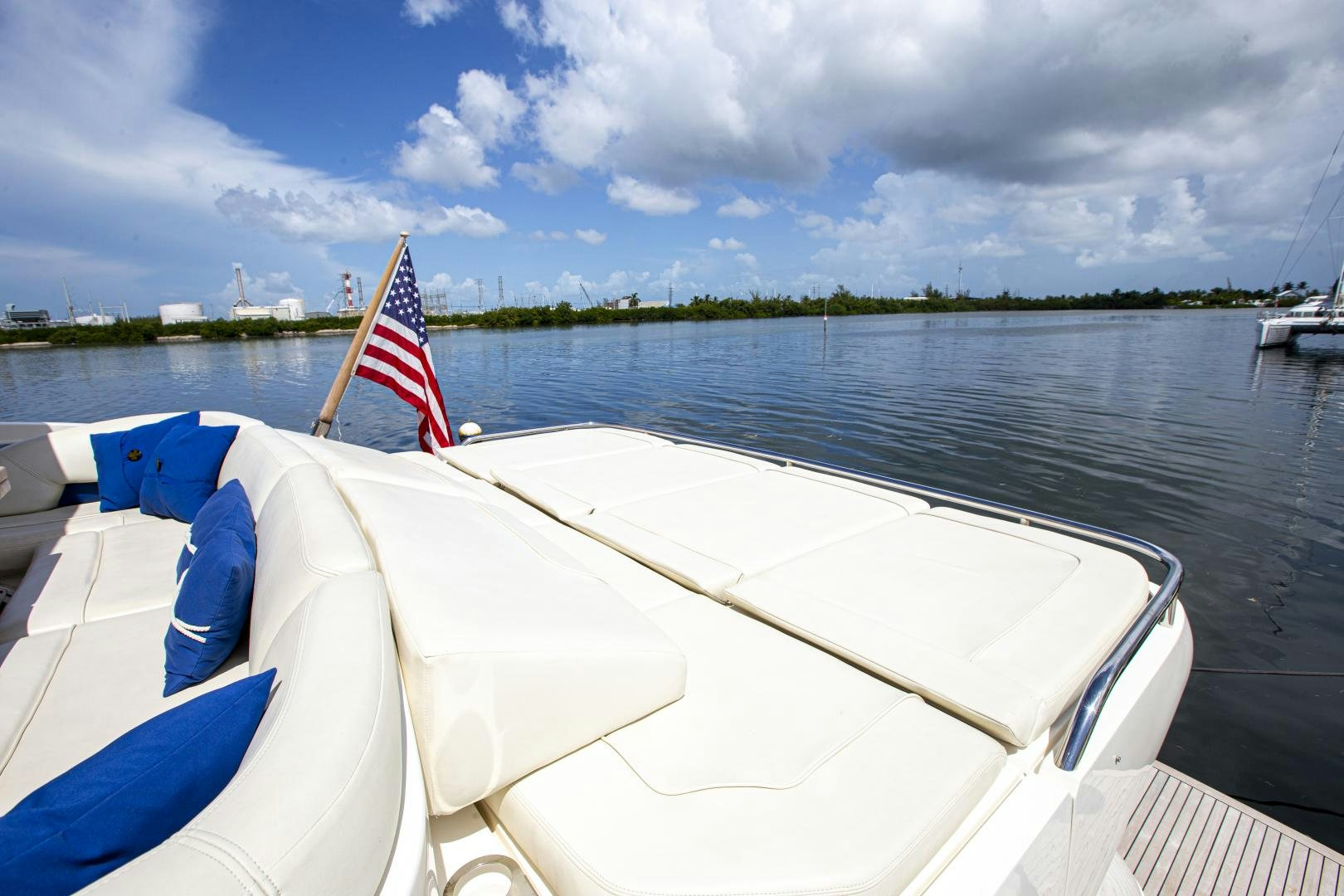 a boat with a flag on the front aboard LAS BRISAS Yacht for Sale