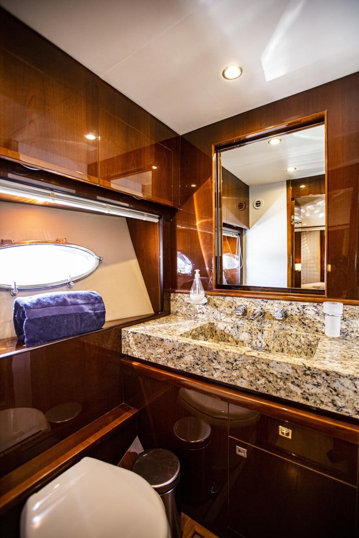 a bathroom with a large mirror aboard LAS BRISAS Yacht for Sale