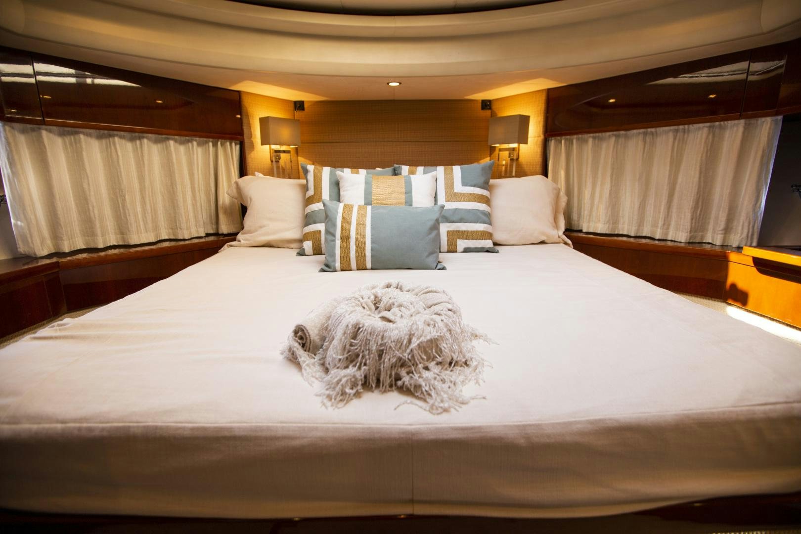 a bed with white sheets aboard LAS BRISAS Yacht for Sale