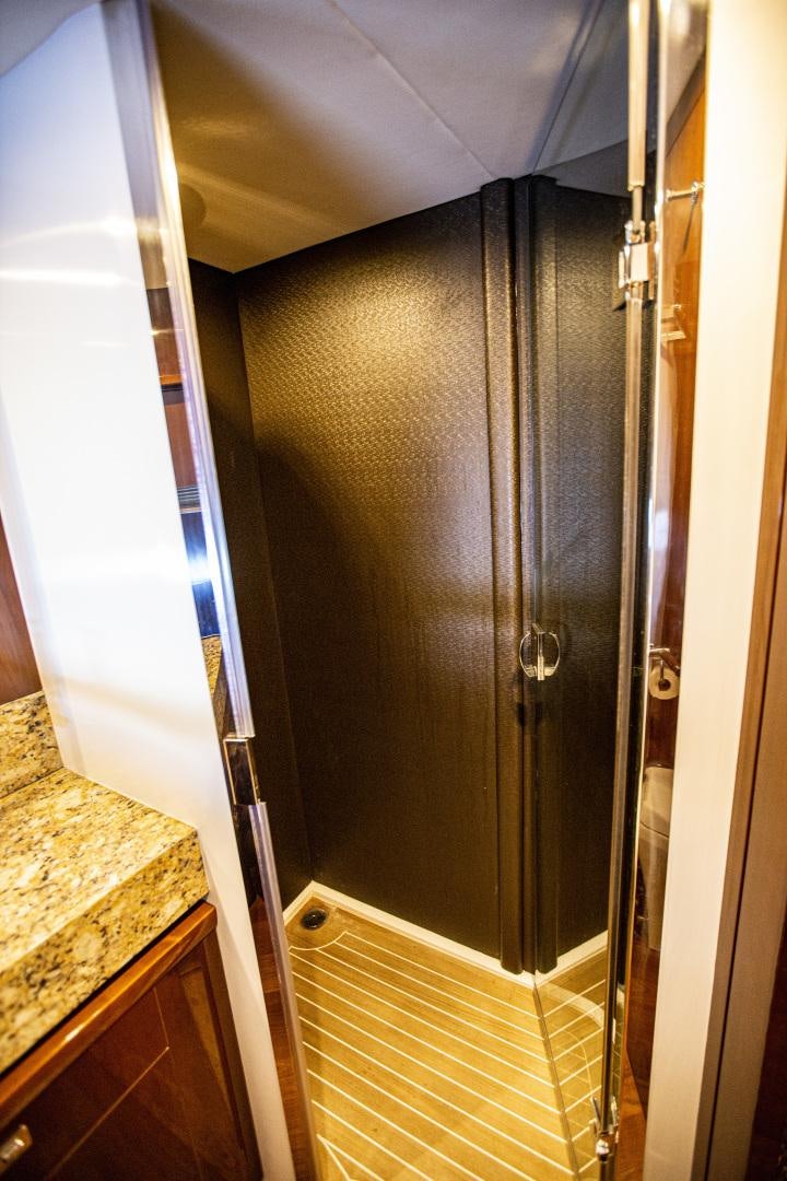 a bathroom with a glass shower aboard LAS BRISAS Yacht for Sale