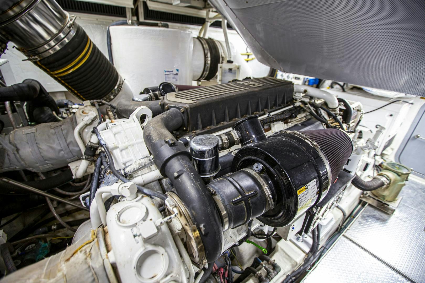 a car engine with a large metal cylinder aboard LAS BRISAS Yacht for Sale