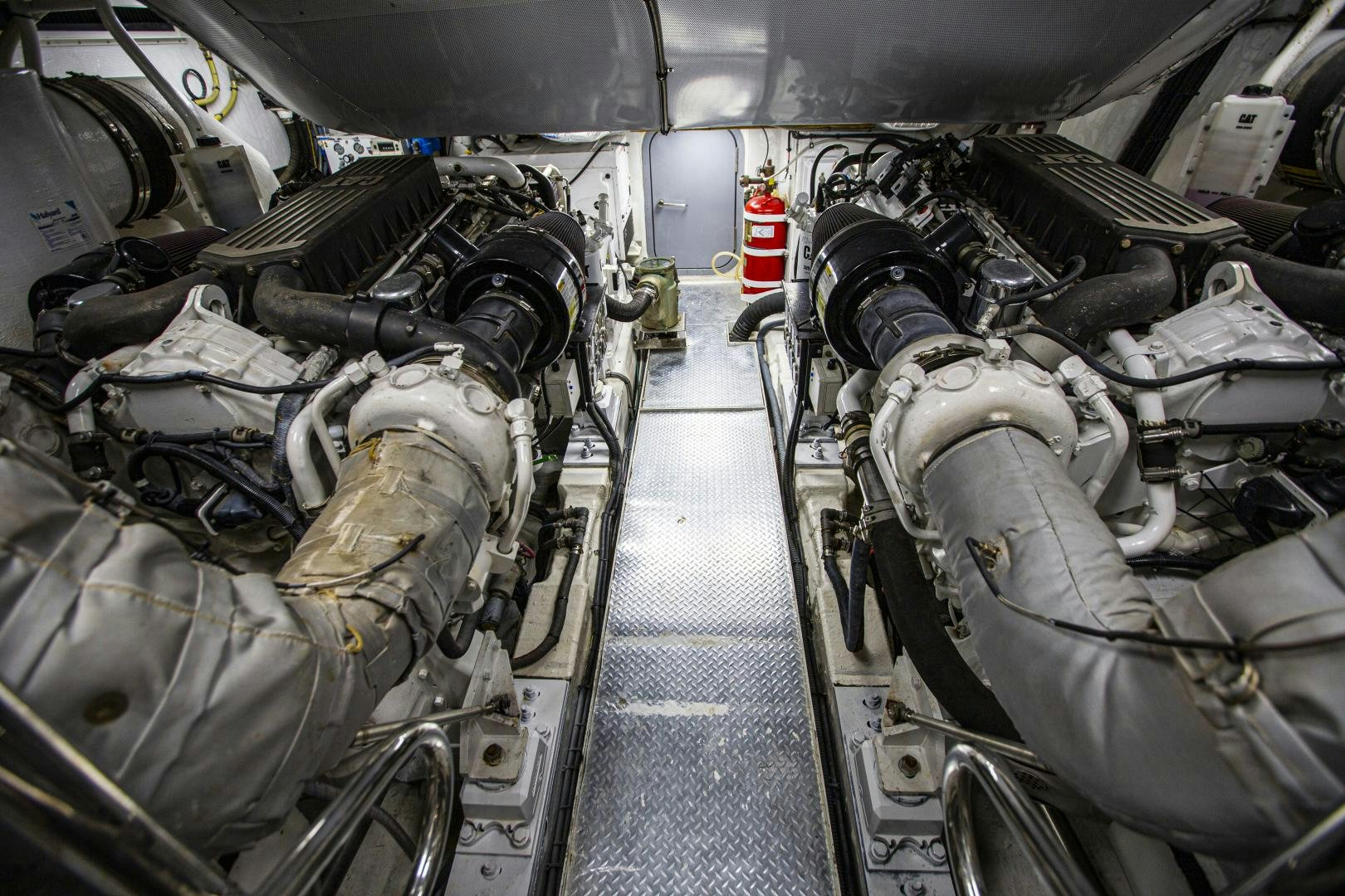 a car with a large engine aboard LAS BRISAS Yacht for Sale