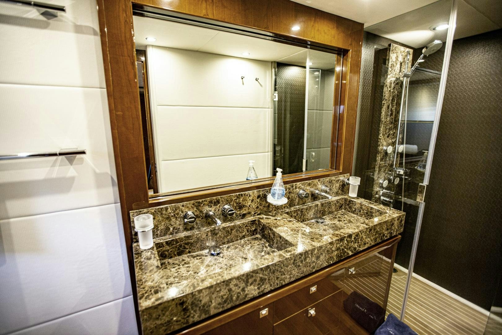 a bathroom with a large mirror aboard LAS BRISAS Yacht for Sale