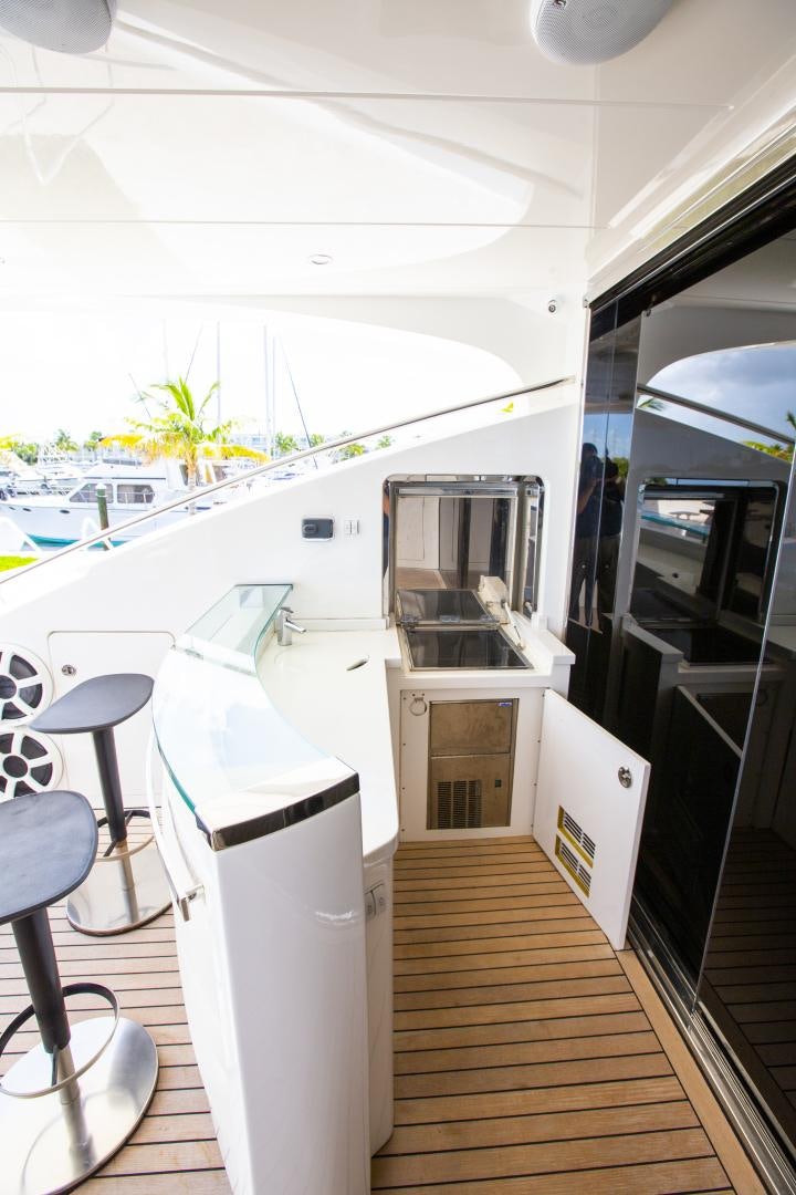 a room with a table and chairs aboard LAS BRISAS Yacht for Sale