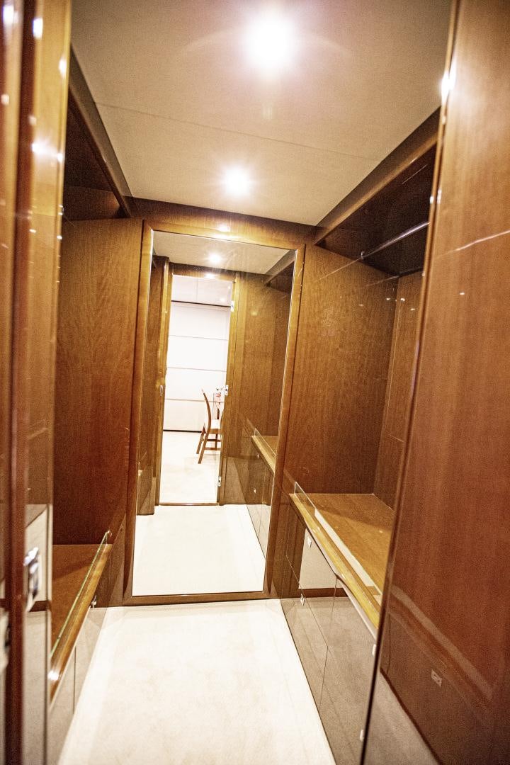 a hallway with a glass door aboard LAS BRISAS Yacht for Sale