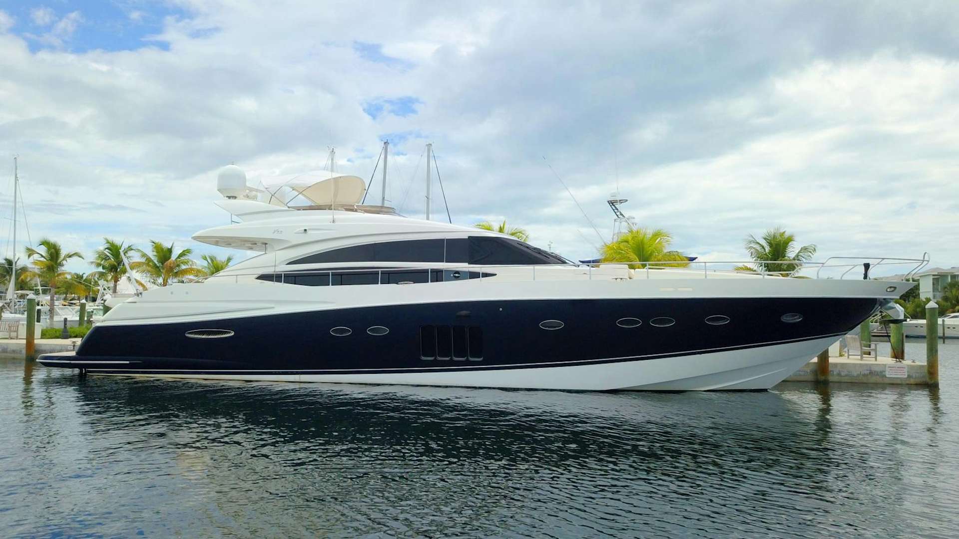 a yacht docked at a dock aboard LAS BRISAS Yacht for Sale