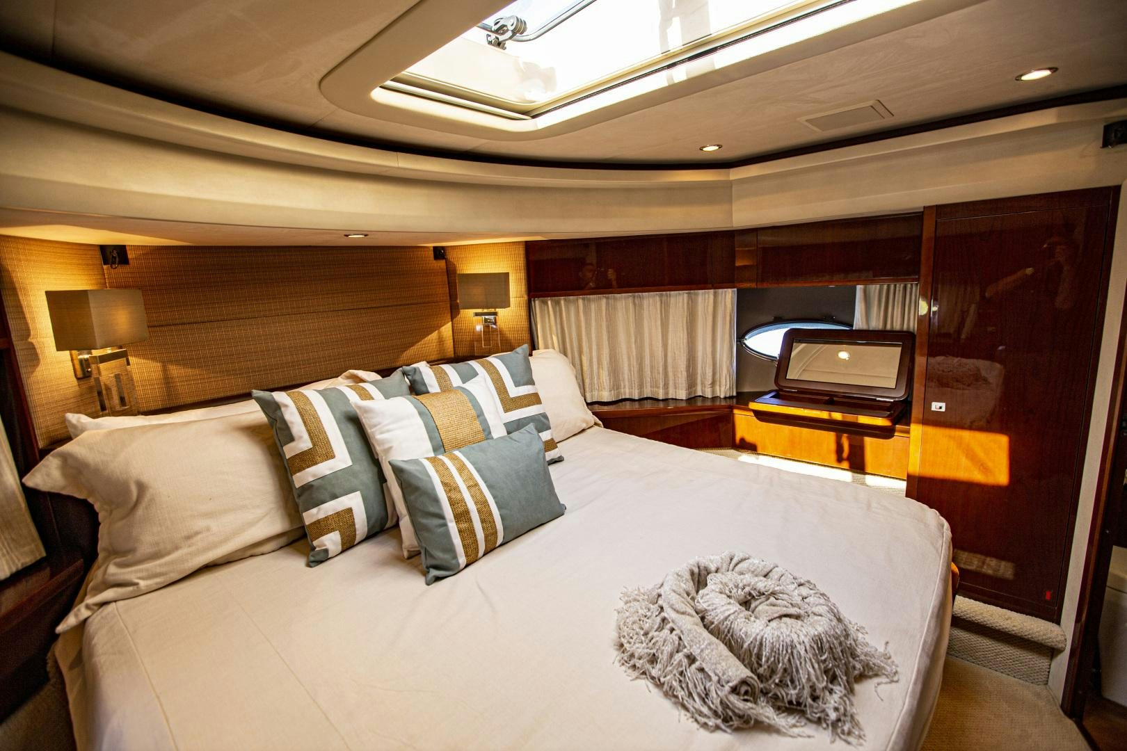 a room with a bed and a television aboard LAS BRISAS Yacht for Sale