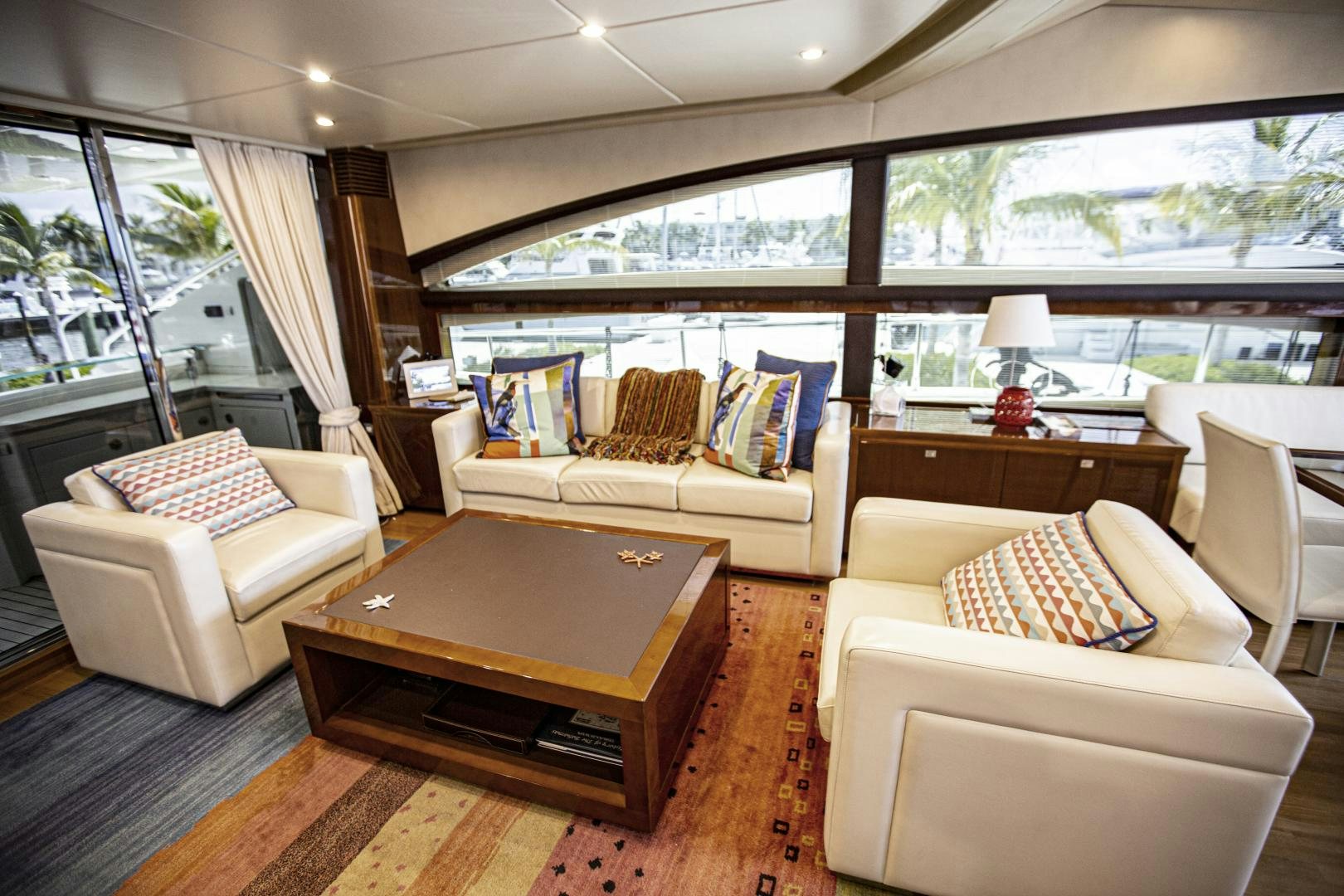 a living room with a couch and a coffee table aboard LAS BRISAS Yacht for Sale