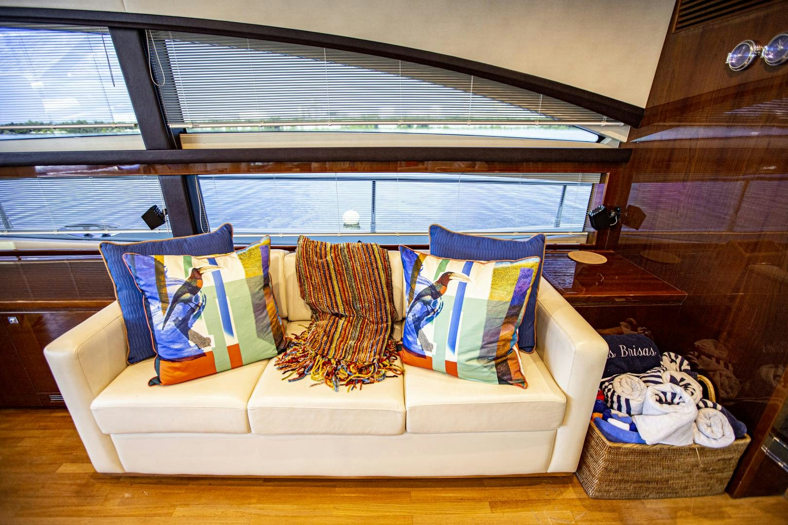 a couch with pillows and blankets aboard LAS BRISAS Yacht for Sale