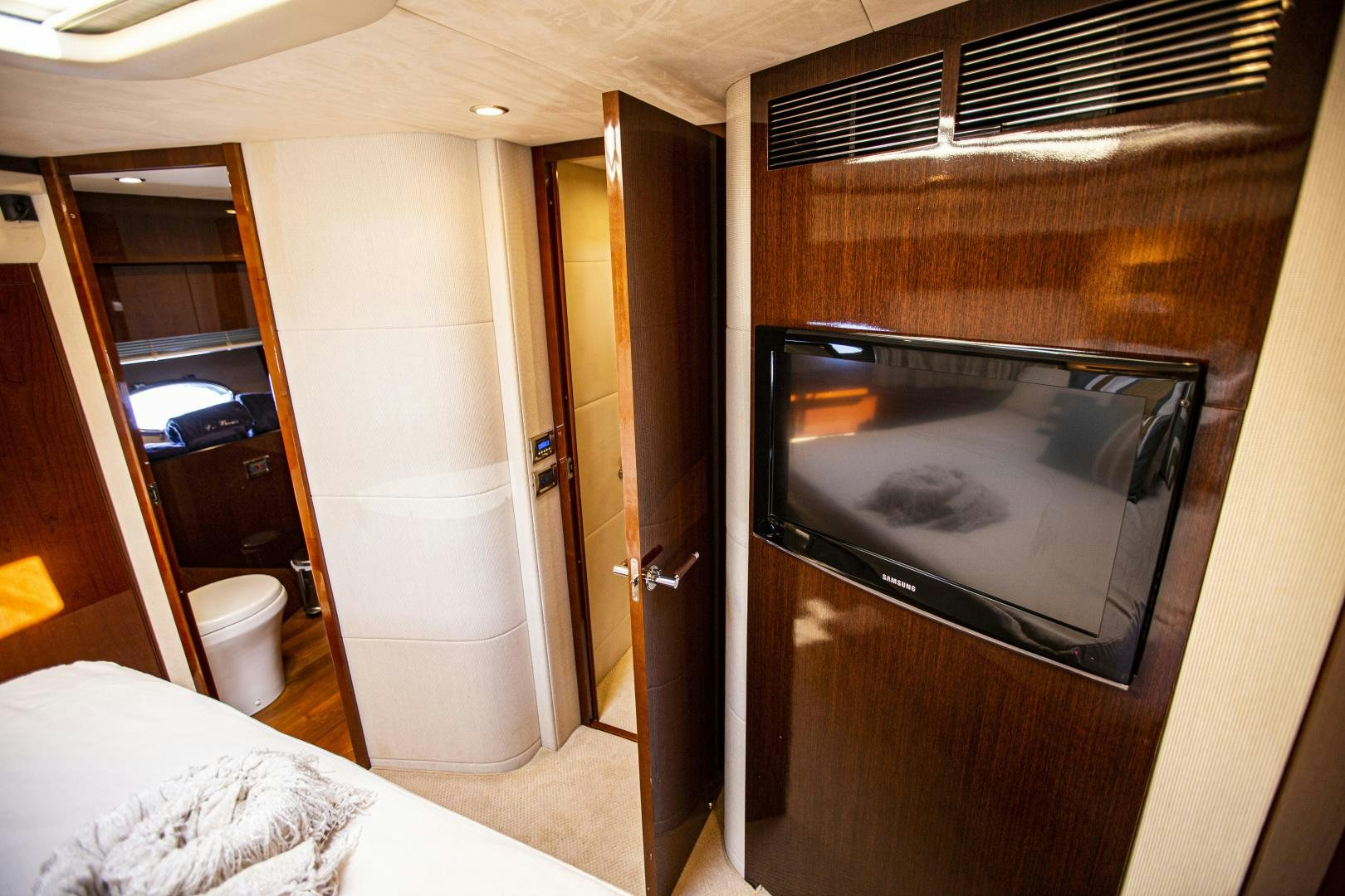 a room with a television and a bed aboard LAS BRISAS Yacht for Sale